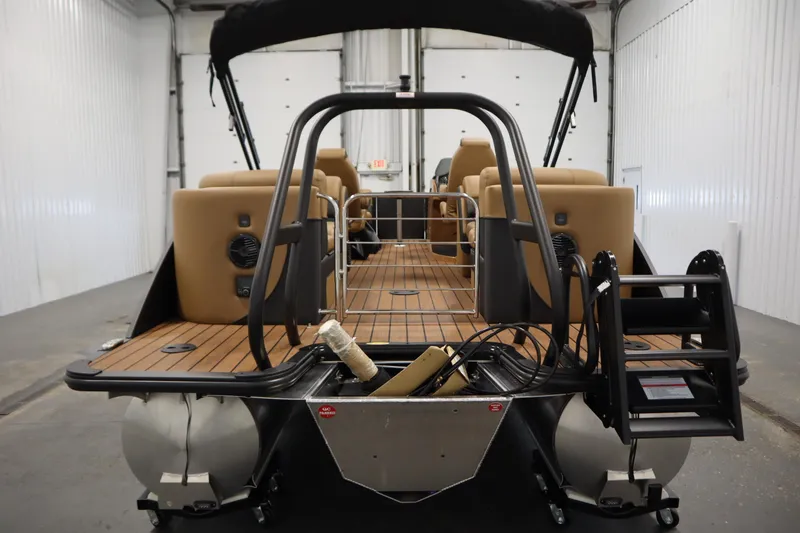 Slide: The Image of 2026 Bentley Pontoons Elite 223 Admiral Tri-toon, rear view in a warehouse setting. - 5