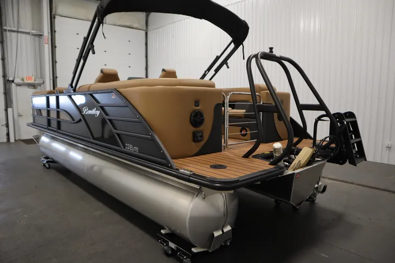 Slide: The Image of 2026 Bentley Pontoons Elite 223 Admiral Tri-toon in a showroom, showcasing luxury design. - 6