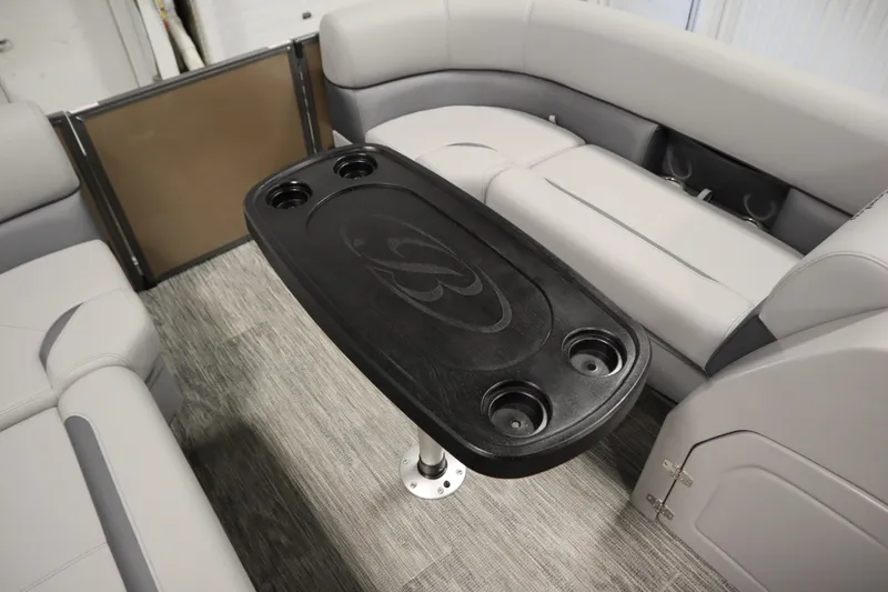Slide: The Image of Interior of 2026 Bentley Pontoons Elite 223 Swingback with storage compartments. - 16