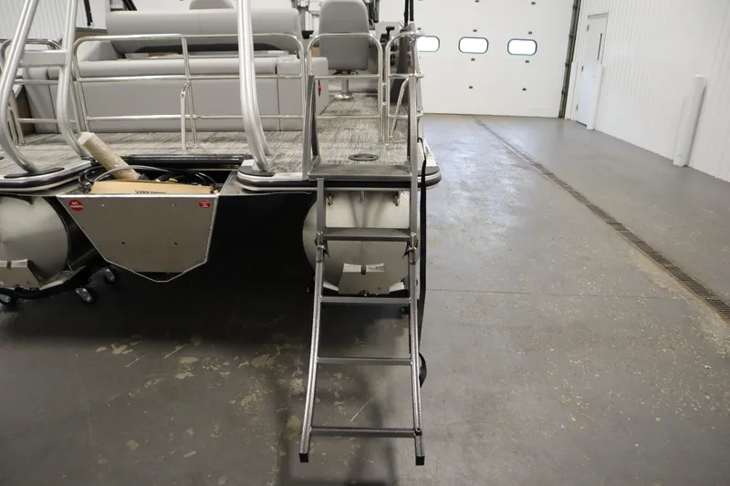 Slide: The Image of 2026 Bentley Pontoons Elite 223 Swingback with cover in storage facility. - 31