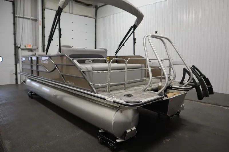 Slide: The Image of 2026 Bentley Pontoons Elite 223 Swingback in a warehouse. - 6