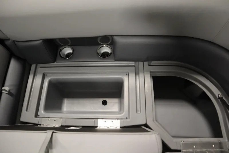 Slide: The Image of Interior of 2026 Bentley Pontoons Legacy 223 Swingback Tri-toon, featuring storage and cup holders. - 13