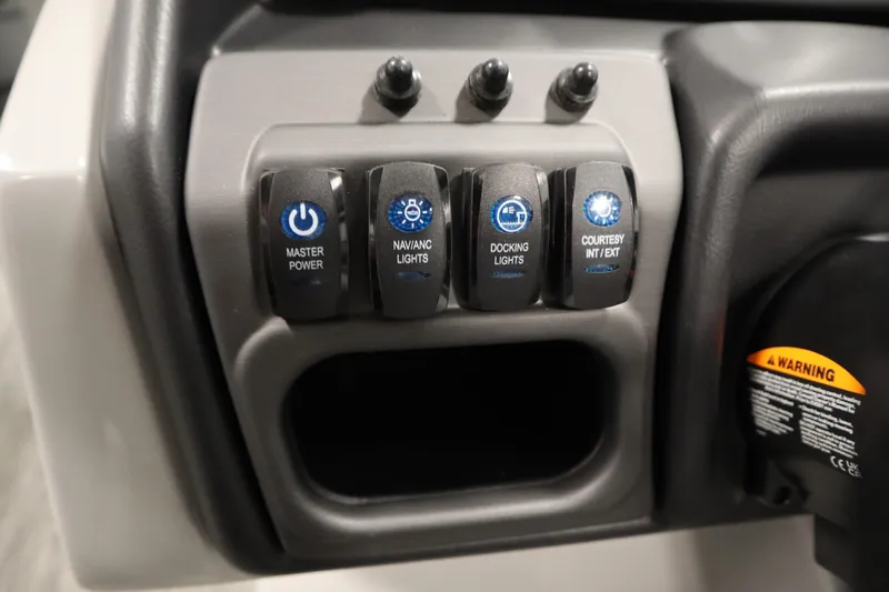 Slide: The Image of Control panel of 2026 Bentley Pontoons Legacy 223 with power and light switches. - 22