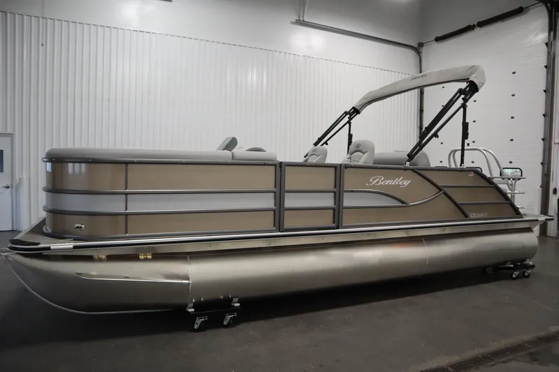 Slide: The Image of 2026 Bentley Pontoons Legacy 223 Swingback Tri-toon in a showroom setting. - 7