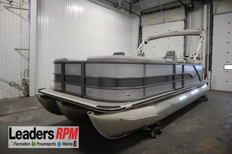 The Image of 2026 Bentley Pontoons LEGACY 223 NAVIGATOR TRI-TOON in a showroom setting. - 0