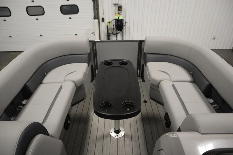 Slide: The Image of 2026 Bentley Pontoons LEGACY 223 NAVIGATOR TRI-TOON interior with gray seating and table. - 10