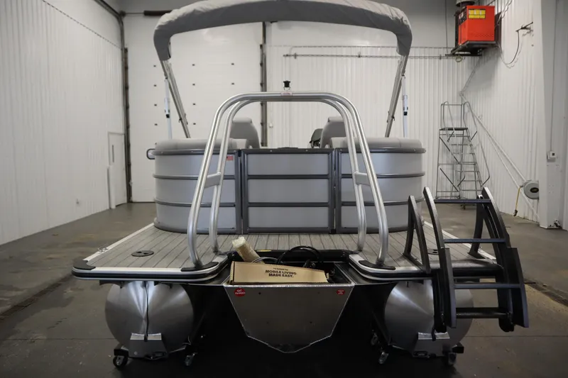 Slide: The Image of 2026 Bentley Pontoons LEGACY 223 NAVIGATOR TRI-TOON in a warehouse setting. - 5