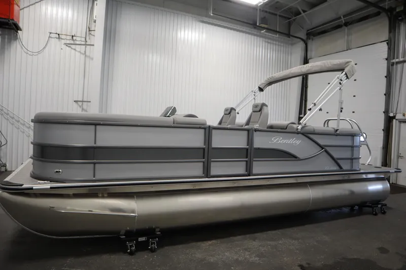 Slide: The Image of 2026 Bentley Pontoons LEGACY 223 NAVIGATOR TRI-TOON in a showroom, side view. - 7