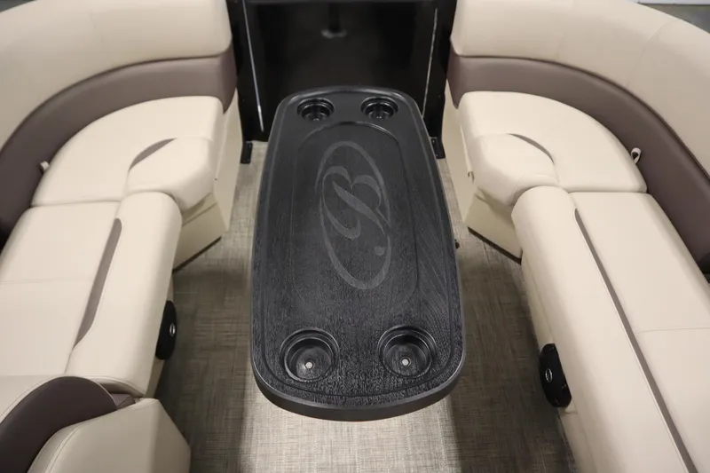Slide: The Image of 2026 Bentley Pontoons LE 200 CW interior with beige seating and black table. - 16