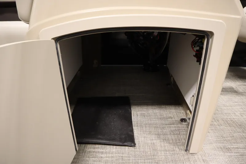 Slide: The Image of 2026 Bentley Pontoons LE 200 CW storage compartment with open door, revealing interior space. - 18