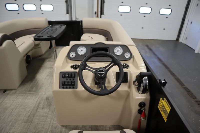 Slide: The Image of 2026 Bentley Pontoons LE 200 CW interior with steering wheel and dashboard controls. - 19