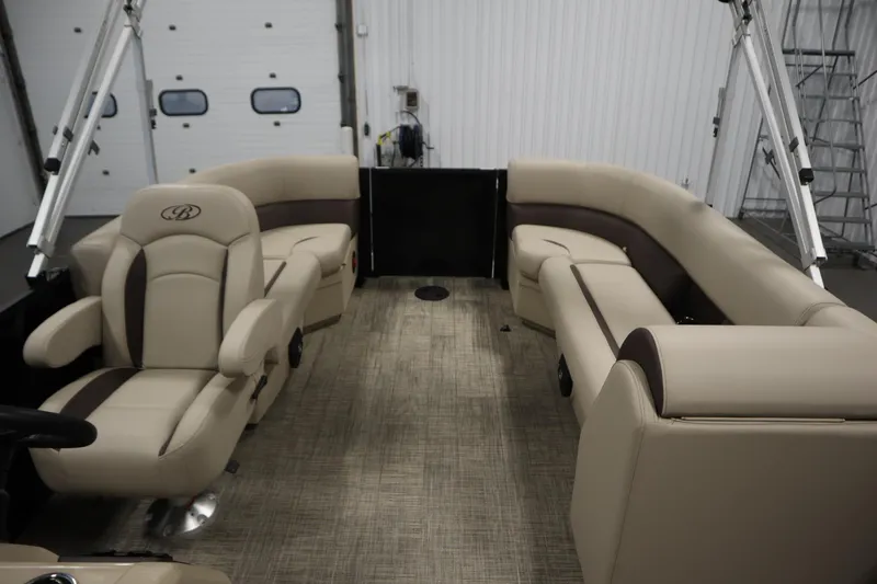 Slide: The Image of 2026 Bentley Pontoons LE 200 CW interior with beige seating and modern design. - 26