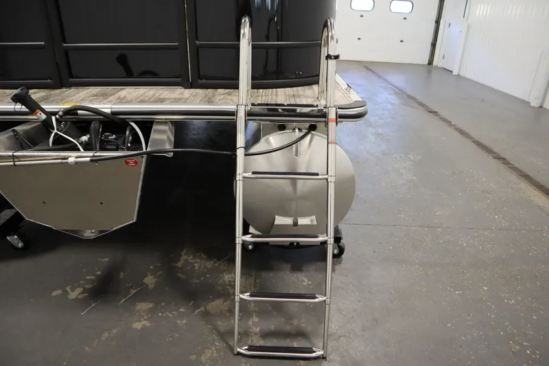 Slide: The Image of 2026 Bentley Pontoons LE 200 CW with ladder in a garage setting. - 33