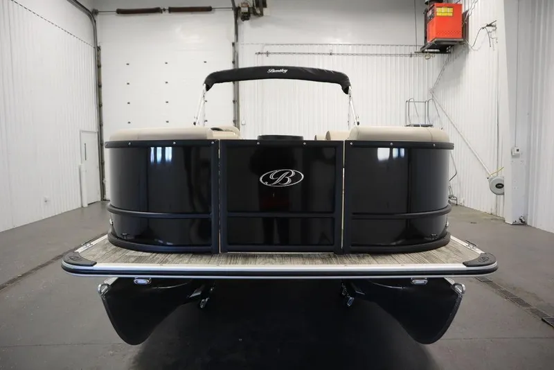 Slide: The Image of 2026 Bentley Pontoons LE 200 CW in a showroom, showcasing sleek black design. - 38