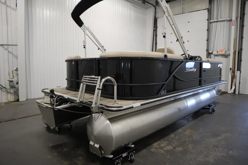 Slide: The Image of 2026 Bentley Pontoons LE 200 CW in a showroom, showcasing sleek design and modern features. - 4