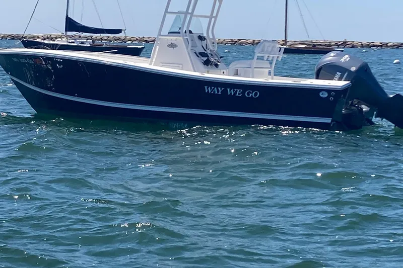 Slide: The Image of 2015 Regulator 23 Forward Seating boat named "Way We Go" on the water. - 4