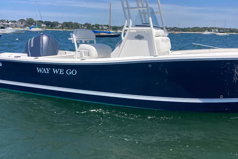 Slide: The Image of 2015 Regulator 23 Forward Seating boat on water, named "Way We Go." - 5