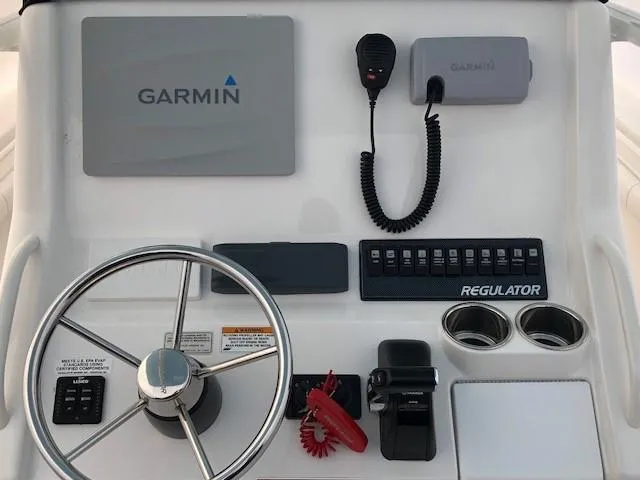 Slide: The Image of 2015 Regulator 23 Forward Seating boat dashboard with Garmin navigation system. - 7
