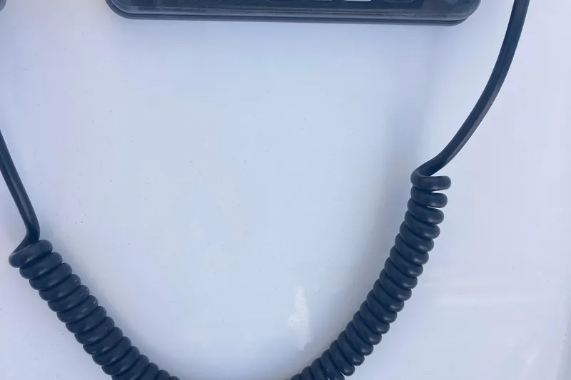 Slide: The Image of Close-up of a coiled cable on a 2015 Regulator 23 Forward Seating boat. - 8