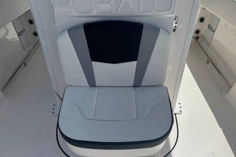 Slide: The Image of 2025 Robalo R250 Center Console boat seat, featuring sleek white and gray design. - 16