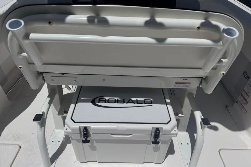 Slide: The Image of 2025 Robalo R250 Center Console boat interior with seating and storage compartment. - 6