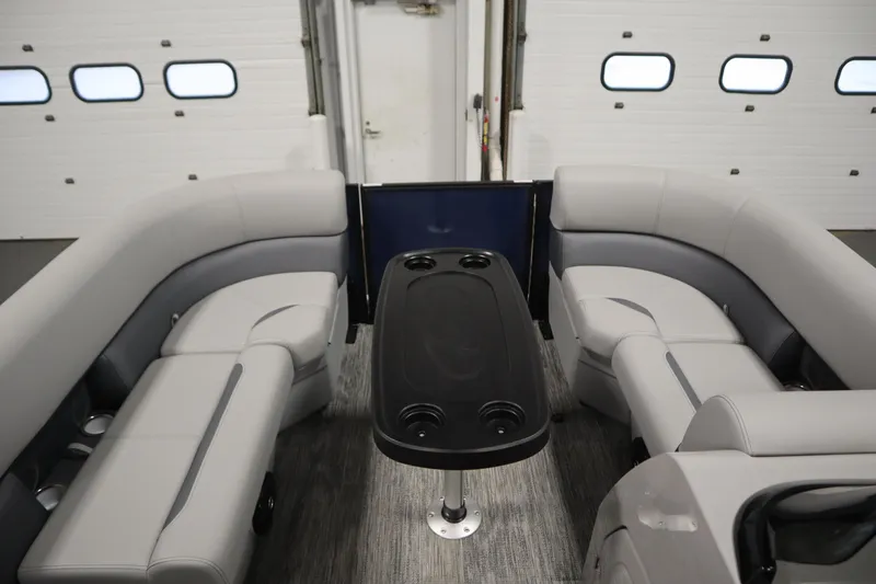 Slide: The Image of 2026 Bentley Pontoons Legacy 200 Cruise XL interior with gray seating and central table. - 10