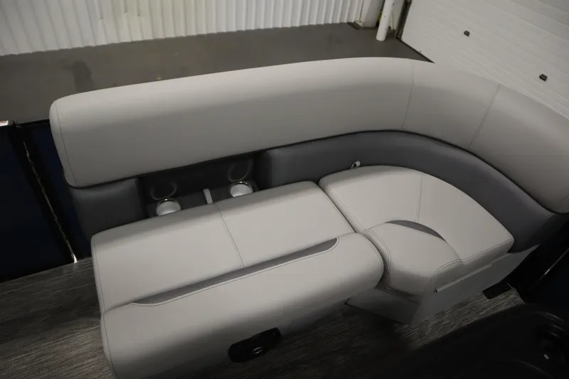 Slide: The Image of 2026 Bentley Pontoons Legacy 200 Cruise XL interior seating with cup holders, showcasing luxury design. - 11