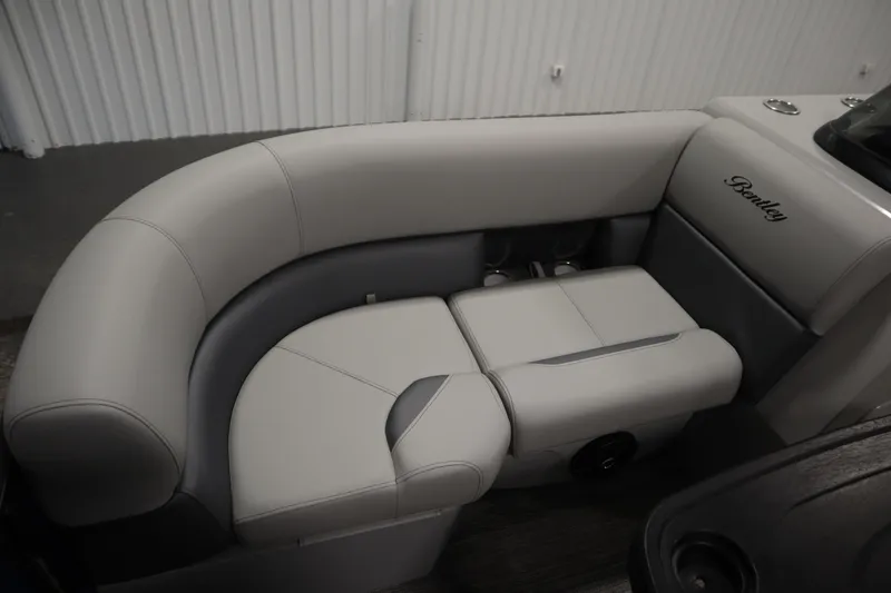 Slide: The Image of 2026 Bentley Pontoons Legacy 200 Cruise XL interior seating, featuring luxurious gray upholstery. - 13