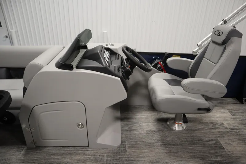 Slide: The Image of 2026 Bentley Pontoons Legacy 200 Cruise XL helm with modern steering and seating. - 16