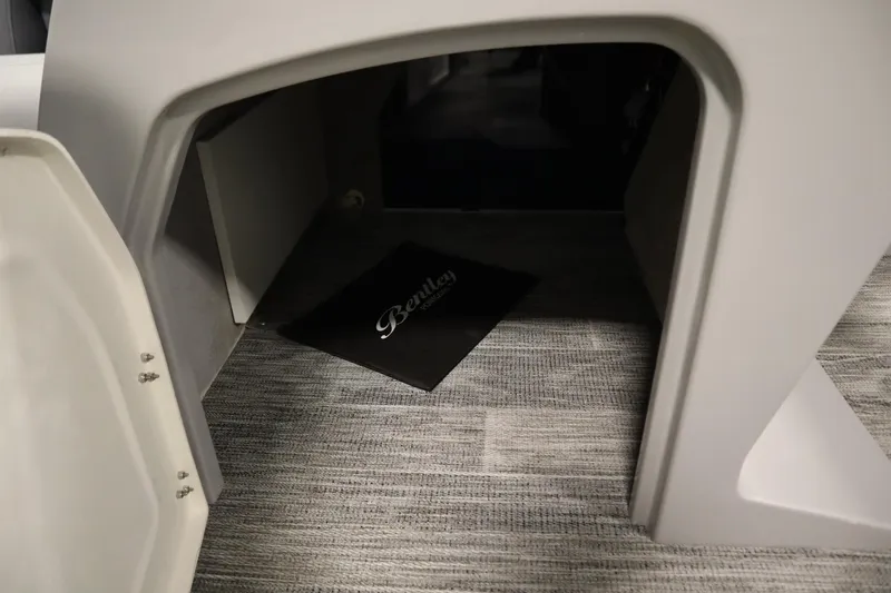 Slide: The Image of 2026 Bentley Pontoons Legacy 200 Cruise XL interior storage compartment with branded mat. - 17