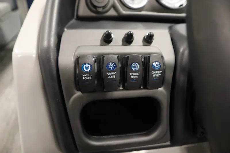 Slide: The Image of Control panel of 2026 Bentley Pontoons Legacy 200 Cruise XL with labeled switches. - 21