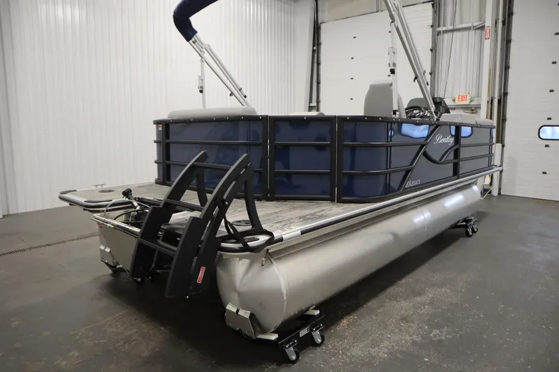 Slide: The Image of 2026 Bentley Pontoons Legacy 200 Cruise XL in a showroom, showcasing sleek design and modern features. - 4