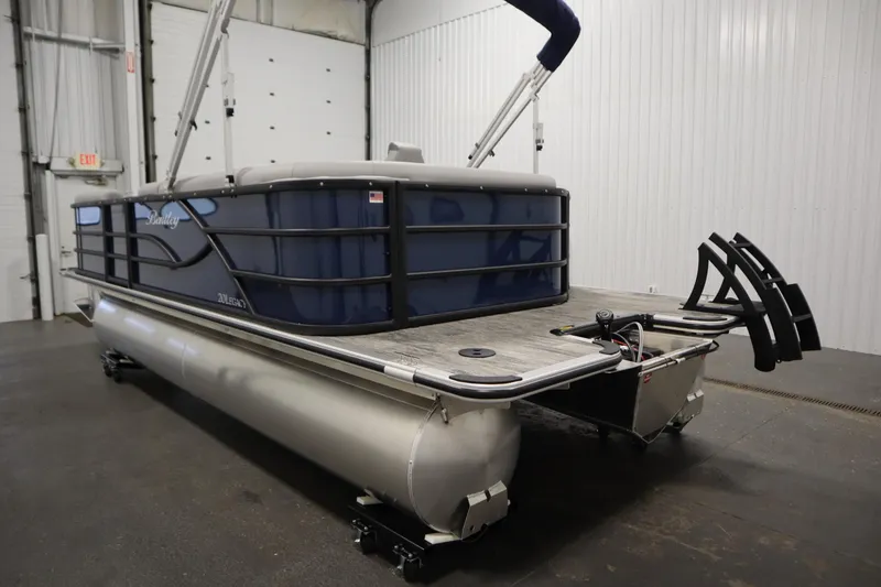 Slide: The Image of 2026 Bentley Pontoons Legacy 200 Cruise XL in a showroom, showcasing sleek design. - 6