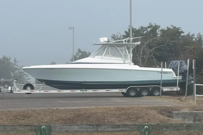 The Image of 2008 Contender 36 Fish Around boat on trailer in foggy outdoor setting. - 0