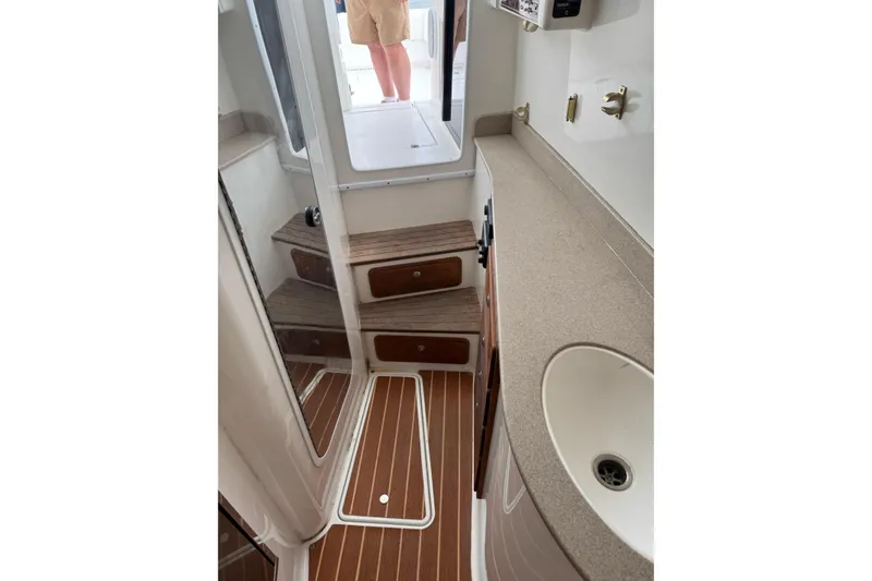 Slide: The Image of 2008 Contender 36 Fisharound cabin interior with wooden steps and countertop. - 13