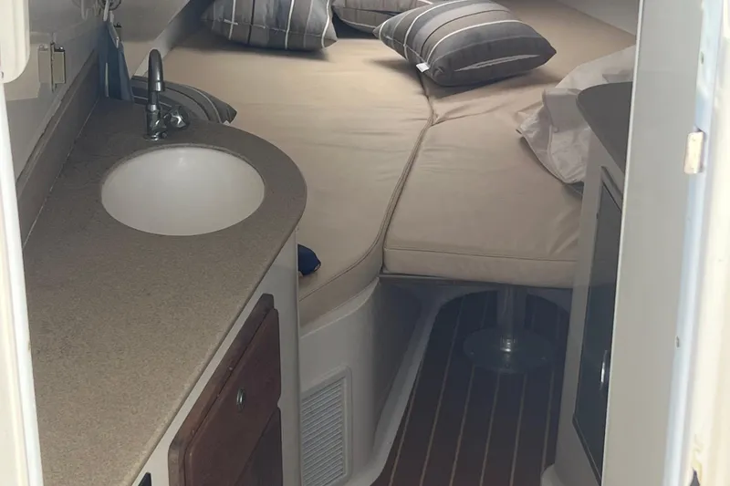 Slide: The Image of 2008 Contender 36 Fisharound boat docked, featuring sleek design and spacious seating. - 3