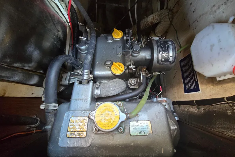 Slide: The Image of 1981 Morgan 321 engine compartment with visible components and wiring. - 11