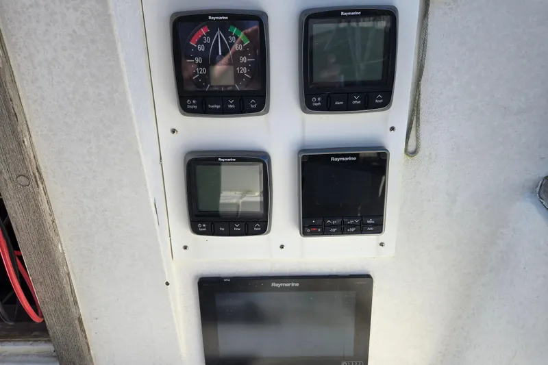 Slide: The Image of Instrumentation panel on a 1981 Morgan 321 sailboat with Raymarine displays. - 3