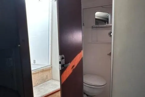 Slide: The Image of 2004 Chaparral Signature 350 bathroom interior with toilet and shower. - 12