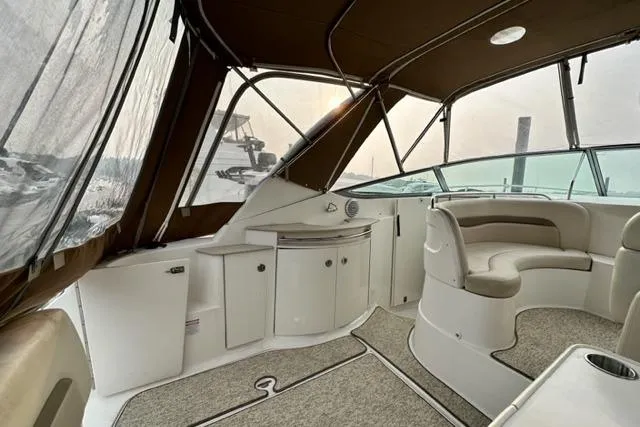 Slide: The Image of 2004 Chaparral Signature 350 boat interior with seating and cabinetry. - 13