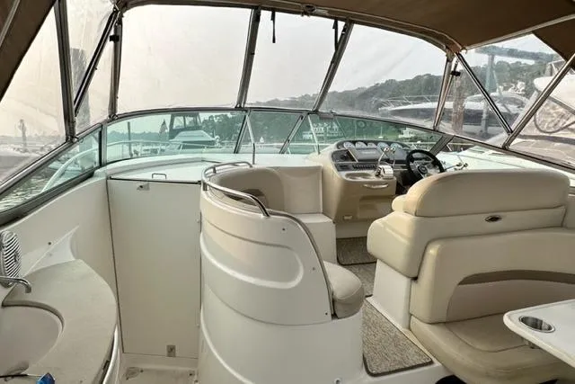 Slide: The Image of 2004 Chaparral Signature 350 boat interior with helm, seating, and panoramic windows. - 16