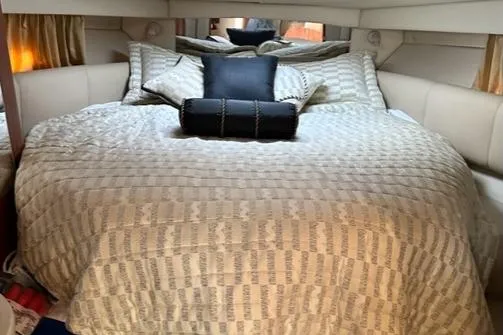 Slide: The Image of Luxurious 2004 Chaparral Signature 350 cabin with elegant bedding and cushions. - 8