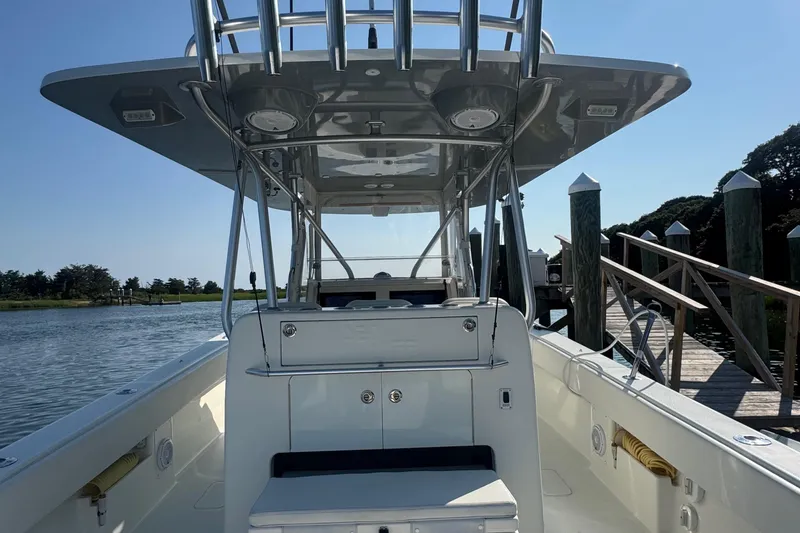 Slide: The Image of 2016 SeaVee 390Z boat interior with open storage compartment and cushioned seating. - 11