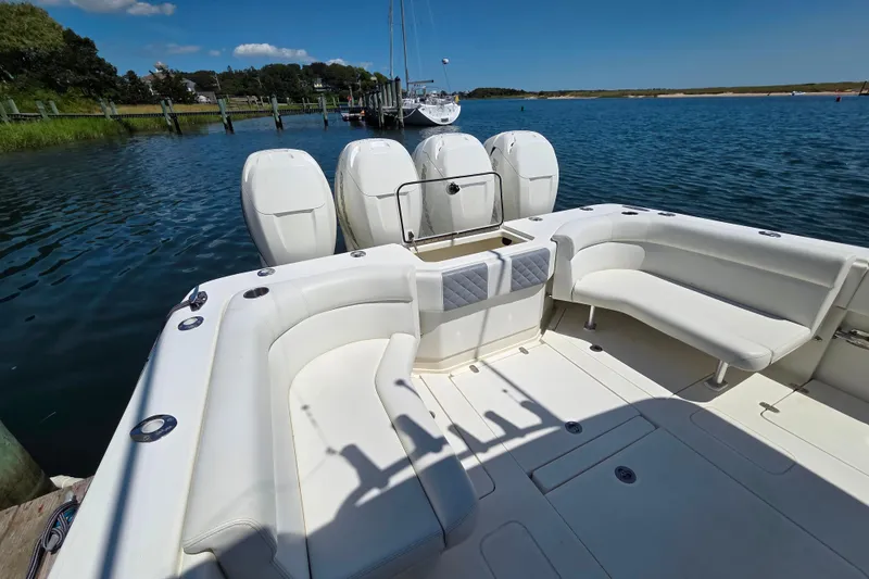 Slide: The Image of 2016 SeaVee 390Z boat with spacious seating and four powerful outboard engines. - 9