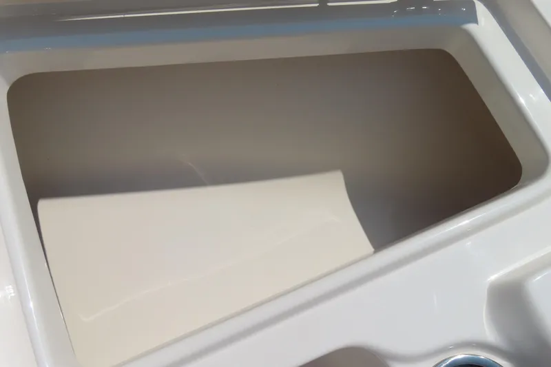 Slide: The Image of Storage compartment of a 2017 Key West 203 FS boat, featuring a clean, white interior. - 10