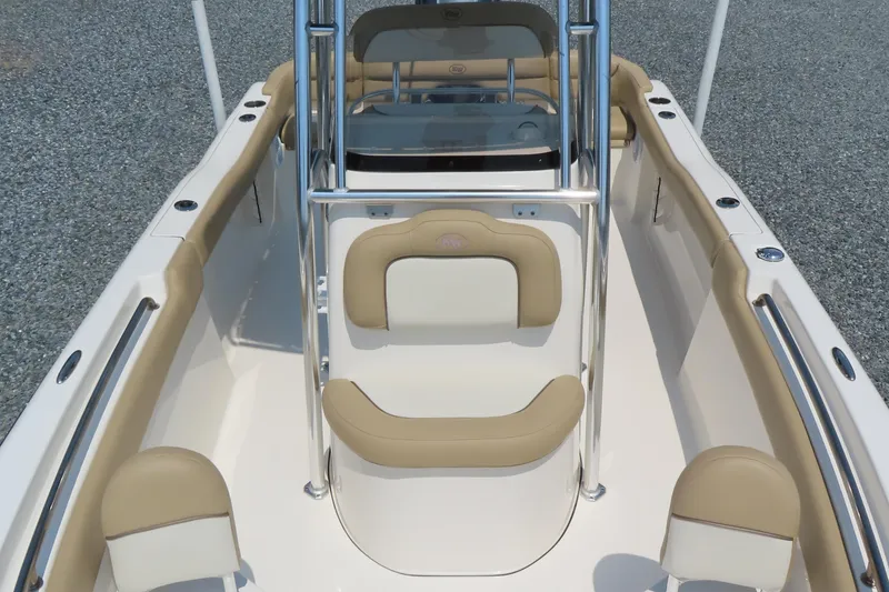 Slide: The Image of 2017 Key West 203 FS boat interior with beige seating and stainless steel railings. - 14