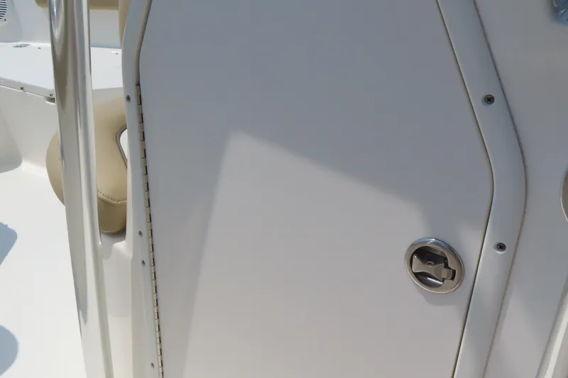 Slide: The Image of 2017 Key West 203 FS boat interior, featuring a sleek white door with a metallic handle. - 19