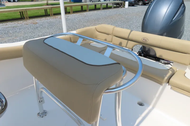 Slide: The Image of 2017 Key West 203 FS boat interior with beige seating and stainless steel railing. - 23