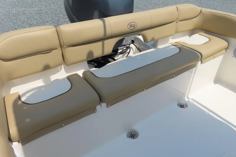 Slide: The Image of 2017 Key West 203 FS boat interior with tan cushioned seating and white deck. - 25