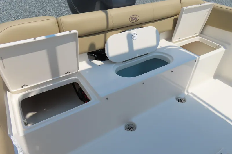 Slide: The Image of 2017 Key West 203 FS boat interior with open storage compartments and seating. - 27